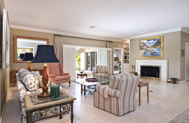 living room featuring ornamental molding, visible vents, a fireplace, and baseboards