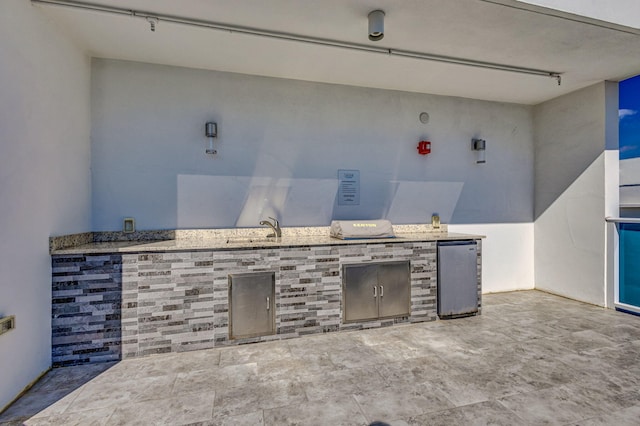 view of patio / terrace featuring exterior kitchen