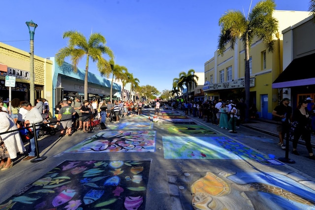 view of street featuring curbs, street lighting, and sidewalks