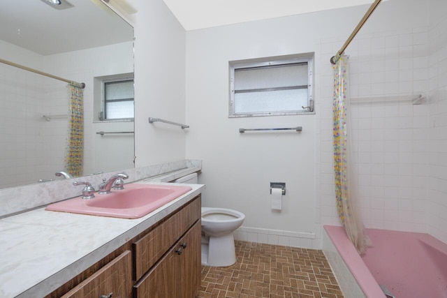 full bathroom with toilet, baseboards, and vanity