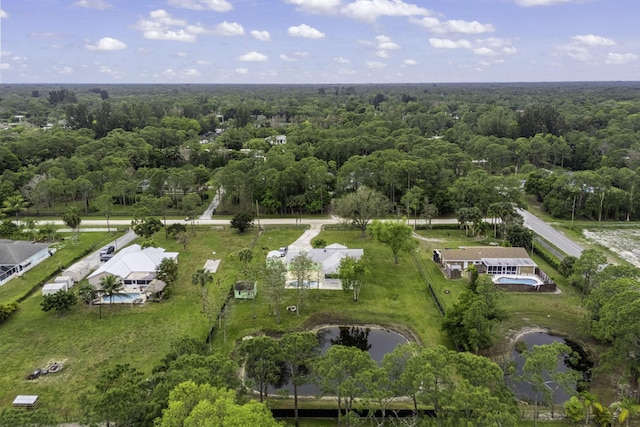 bird's eye view featuring a water view and a wooded view