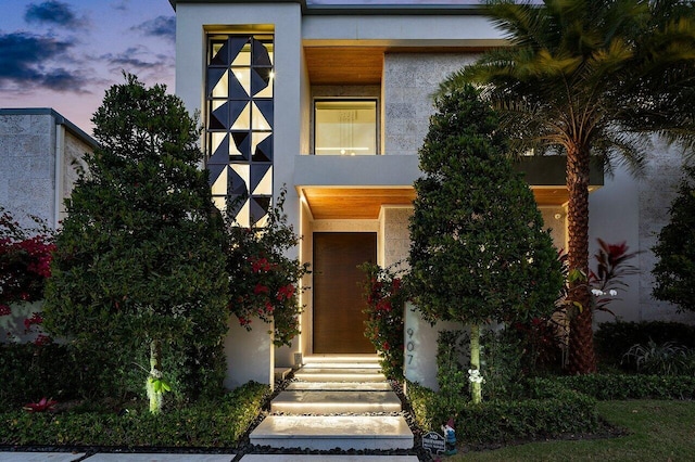 view of front of house featuring stucco siding