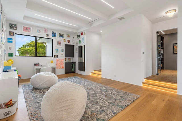 bedroom with wood finished floors and visible vents