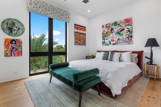 bedroom featuring recessed lighting, visible vents, and light wood-style flooring