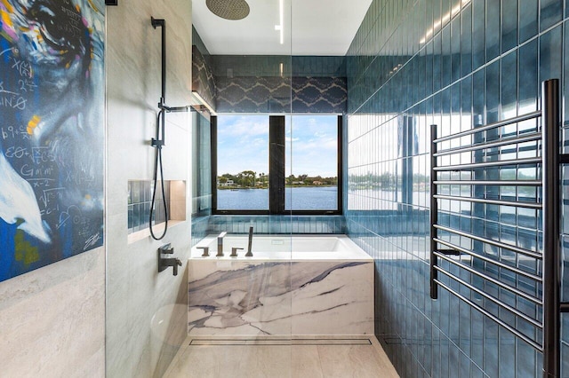 full bath featuring a water view, a bath, and walk in shower