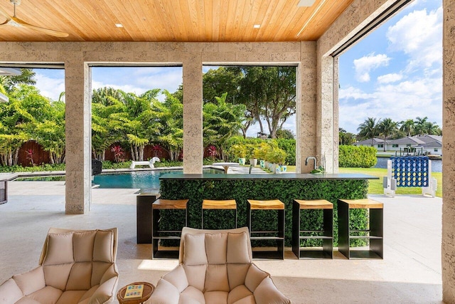 sunroom featuring wood ceiling