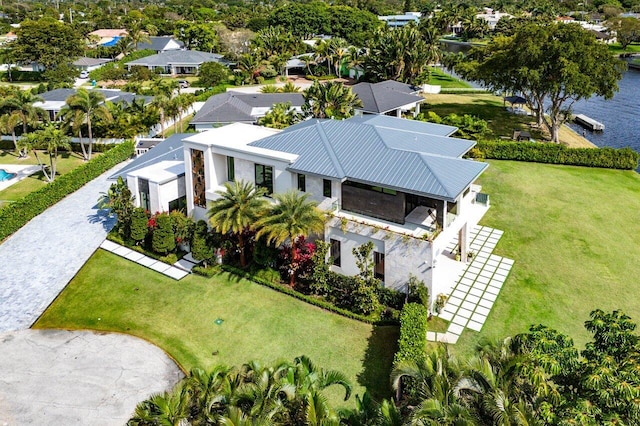 drone / aerial view featuring a residential view and a water view