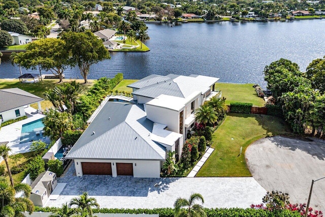 birds eye view of property with a water view and a residential view