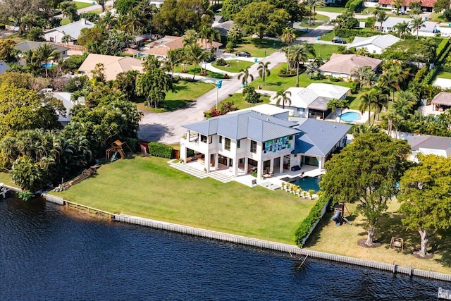 bird's eye view with a residential view and a water view