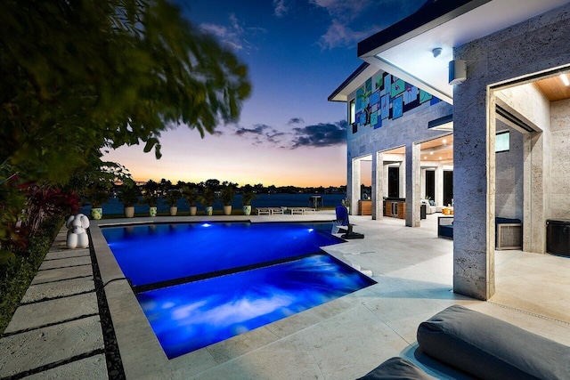 pool featuring a patio area