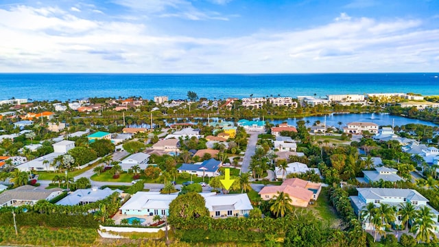 bird's eye view with a residential view and a water view