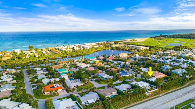 birds eye view of property with a residential view and a water view