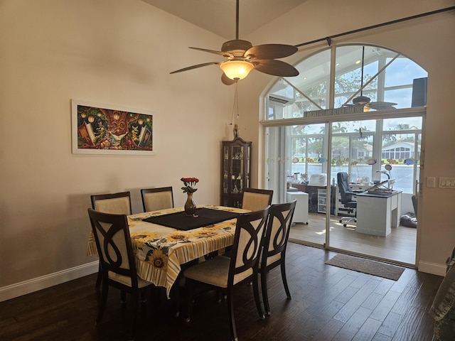 dining space with ceiling fan, high vaulted ceiling, dark wood-style flooring, and a healthy amount of sunlight