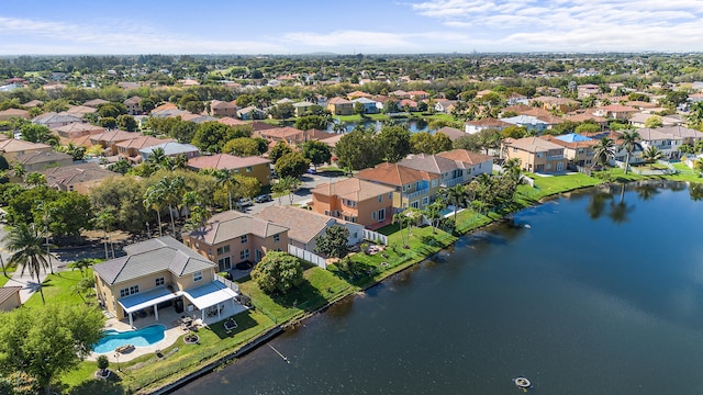 bird's eye view with a residential view and a water view