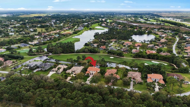 bird's eye view with a residential view, a water view, and golf course view