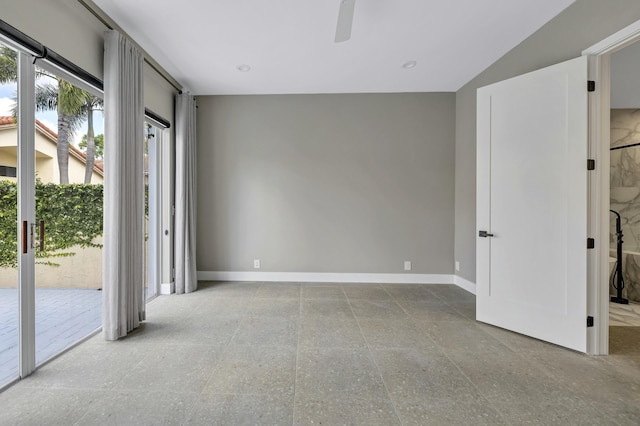 unfurnished room featuring a ceiling fan and baseboards