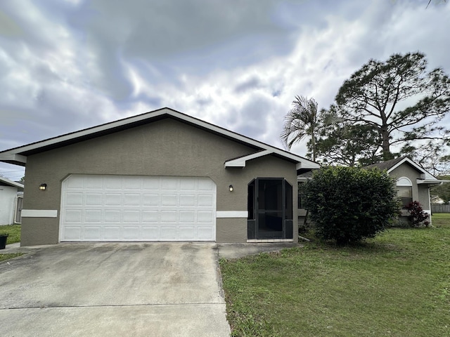 ranch-style home featuring an attached garage, a front lawn, concrete driveway, and stucco siding