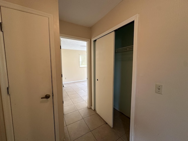 hallway with light tile patterned floors