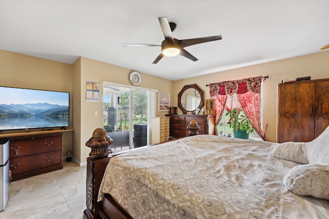 bedroom with access to exterior, ceiling fan, and baseboards