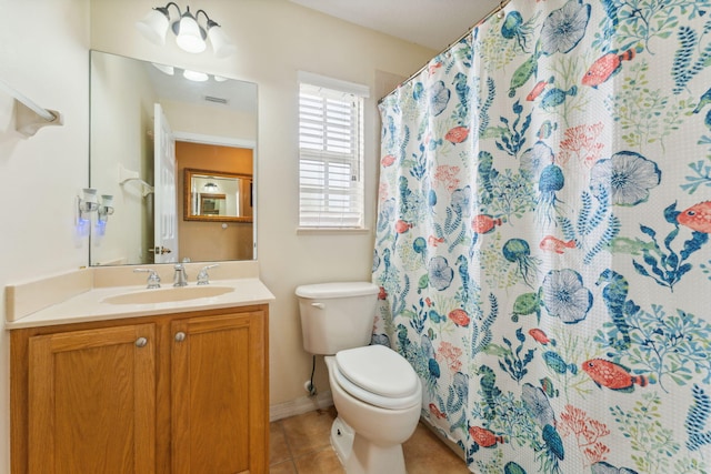 full bath with tile patterned flooring, curtained shower, vanity, and toilet