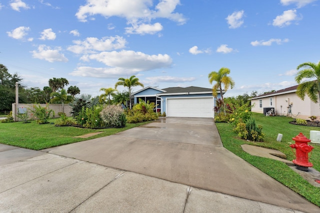 ranch-style house featuring a garage, concrete driveway, fence, and a front lawn