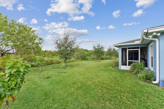 view of yard featuring a sunroom