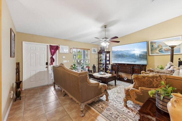 living room featuring a ceiling fan and light tile patterned flooring