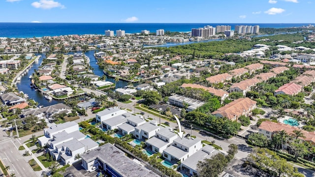 birds eye view of property with a residential view and a water view
