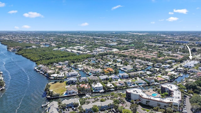 drone / aerial view featuring a water view and a residential view