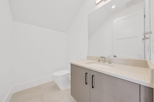 half bath featuring vaulted ceiling, tile patterned floors, vanity, toilet, and visible vents