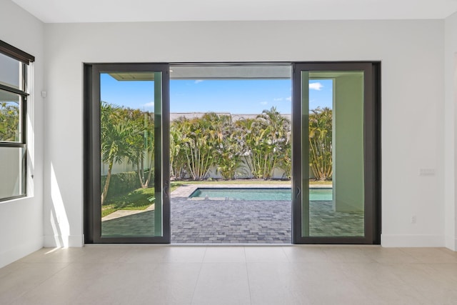 doorway to outside featuring a healthy amount of sunlight