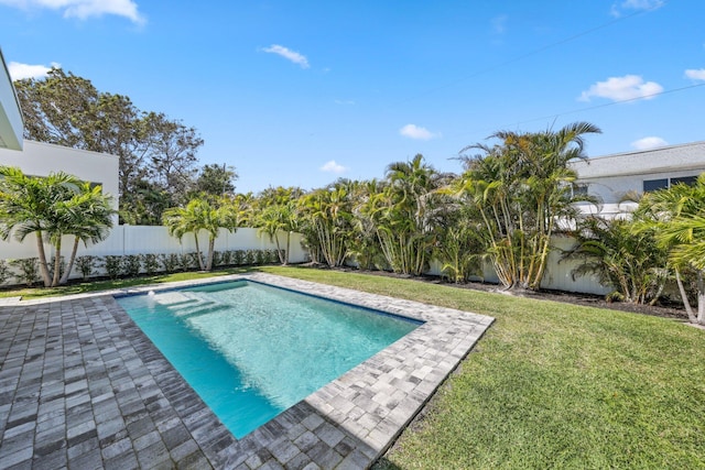 view of swimming pool featuring a fenced backyard, a fenced in pool, and a yard