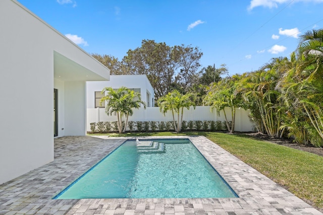 view of pool featuring a fenced backyard, a patio, a yard, and a fenced in pool