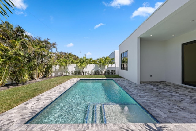 view of pool with a fenced backyard, a fenced in pool, a patio area, and a lawn