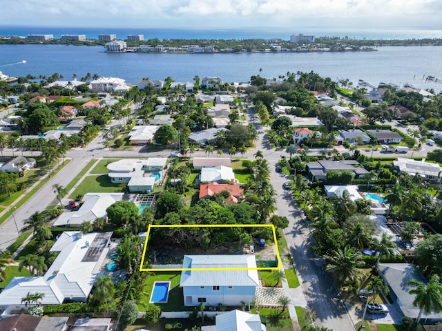 bird's eye view with a residential view and a water view