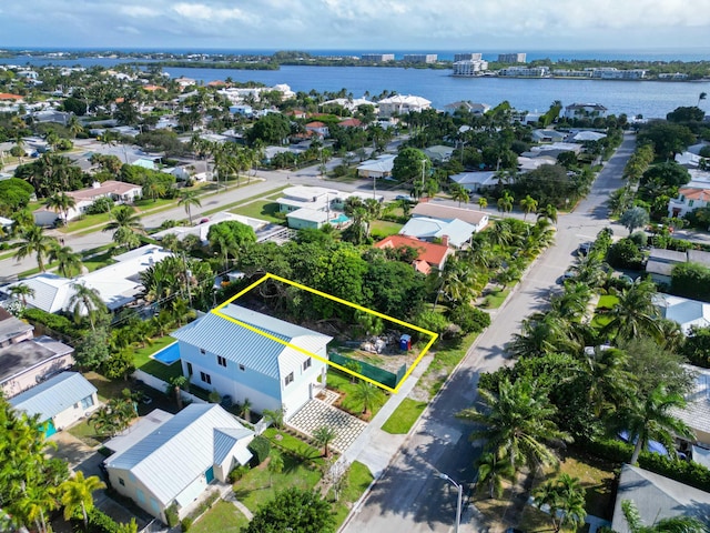 bird's eye view featuring a residential view and a water view