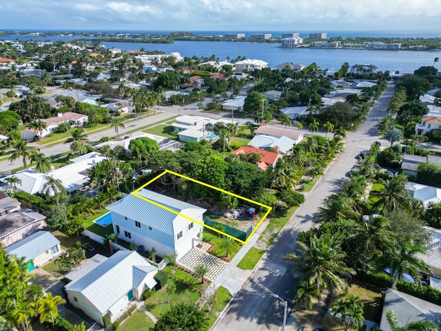 122 Auburn Dr, Lake Worth, FL 33460 - aerial view of residential area featuring property parcel outlined and a large body of water