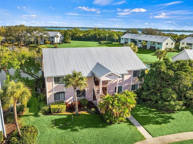 bird's eye view with a residential view and a water view