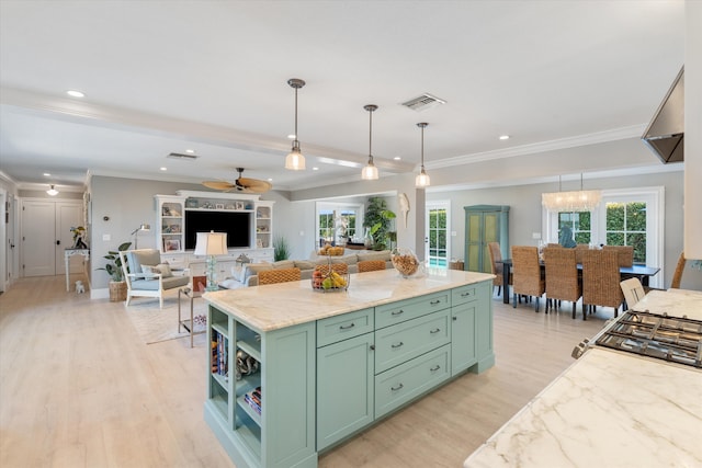 kitchen with green cabinets, plenty of natural light, visible vents, and light wood-type flooring