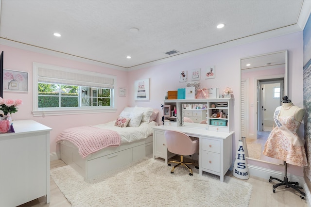 bedroom featuring recessed lighting, multiple windows, and ornamental molding