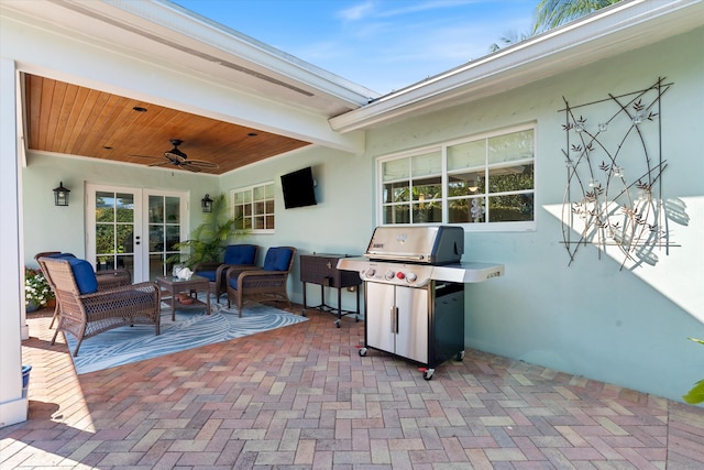 view of patio featuring area for grilling, outdoor lounge area, and a ceiling fan