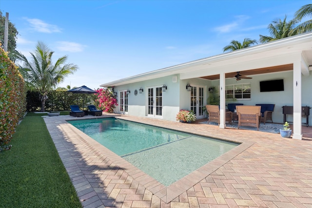 view of pool featuring a fenced in pool, ceiling fan, french doors, outdoor lounge area, and a patio