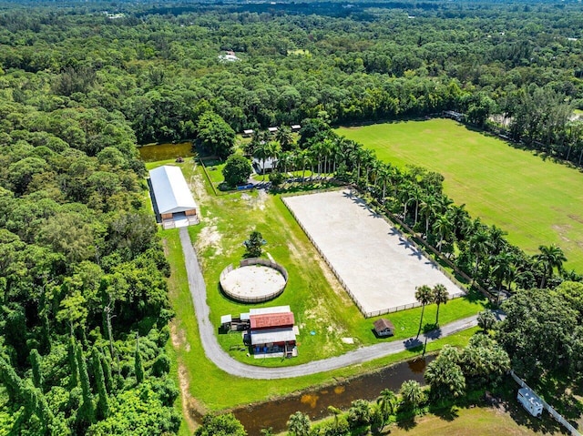 bird's eye view featuring a wooded view