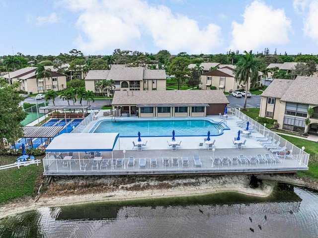 birds eye view of property featuring a water view and a residential view