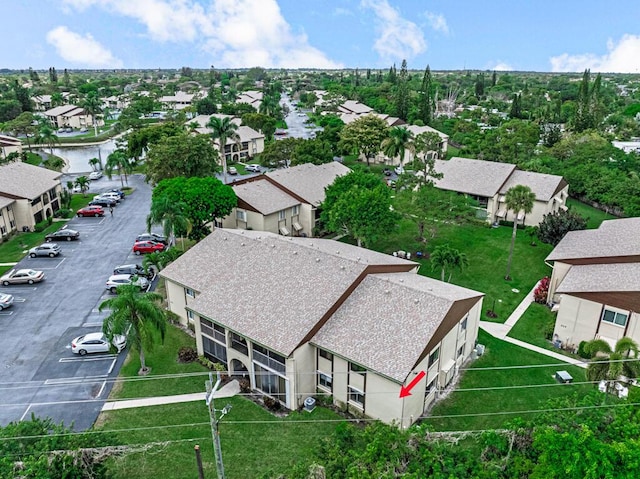 bird's eye view with a water view and a residential view