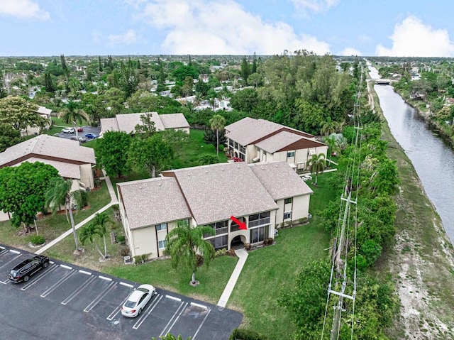 bird's eye view with a water view and a residential view