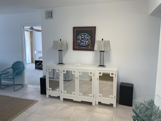 interior details with visible vents and a ceiling fan