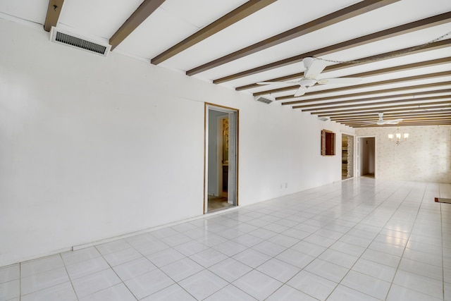 empty room with light tile patterned floors, visible vents, beamed ceiling, and ceiling fan with notable chandelier