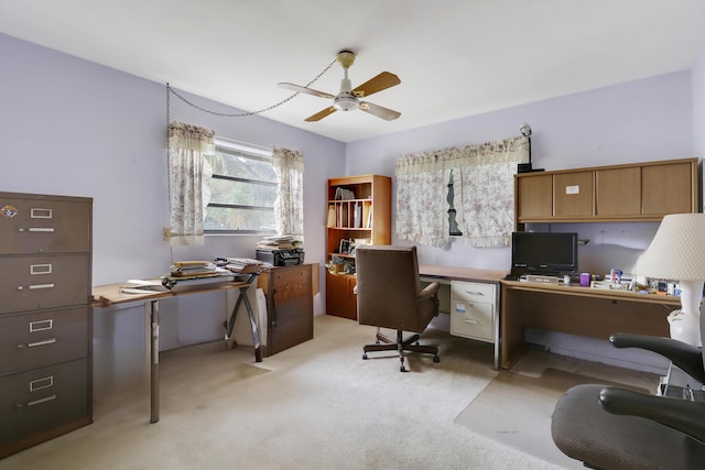 office with ceiling fan and light carpet