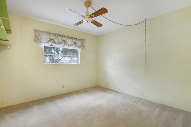 unfurnished room featuring carpet floors and ceiling fan